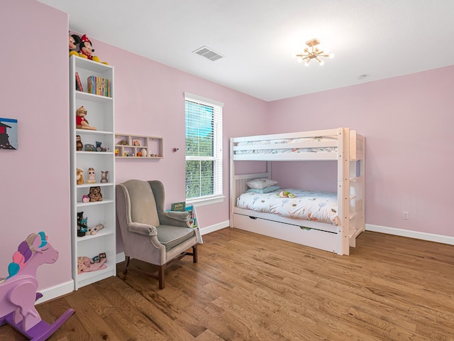 bedroom with wood-type flooring