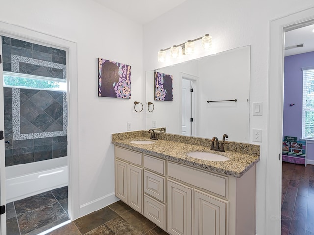 bathroom featuring vanity and bathtub / shower combination