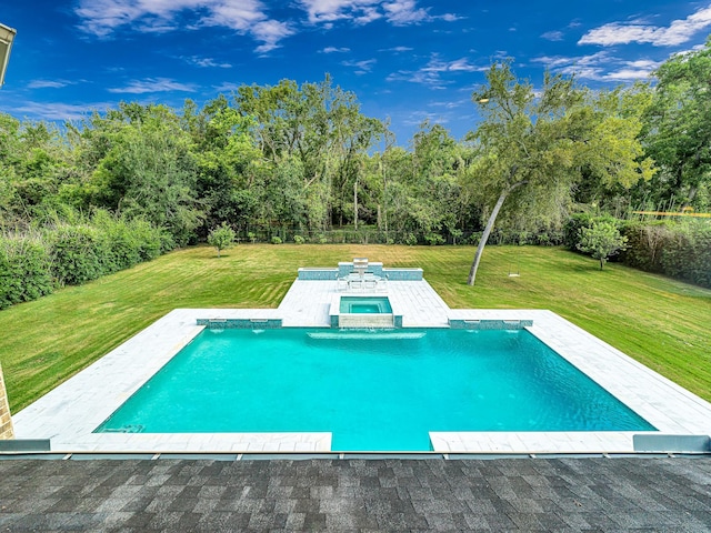 view of swimming pool featuring an in ground hot tub and a lawn