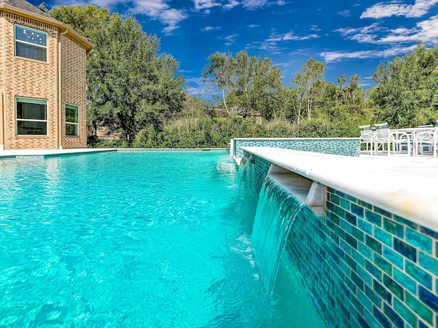 view of pool featuring pool water feature