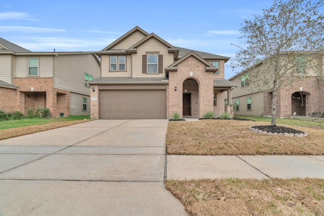 view of front of house with a garage and a front lawn