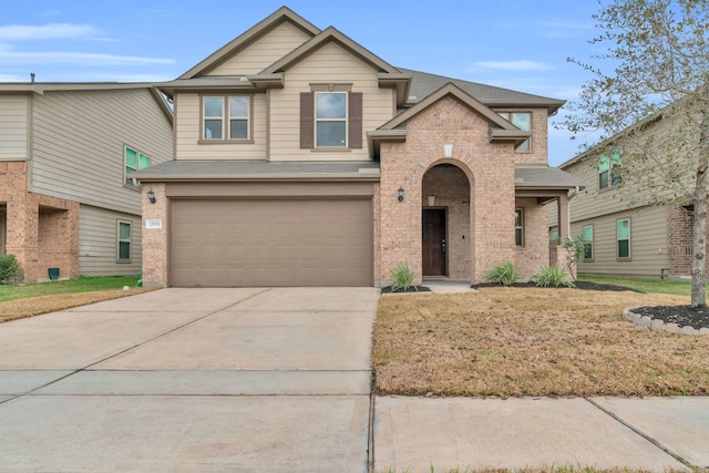 view of front of property with a garage and a front yard