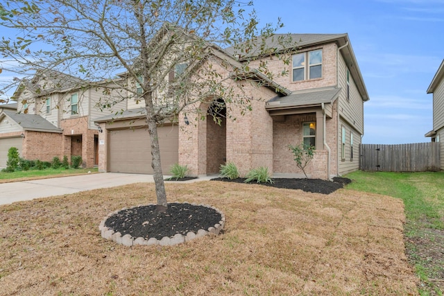 view of front facade featuring a garage and a front lawn