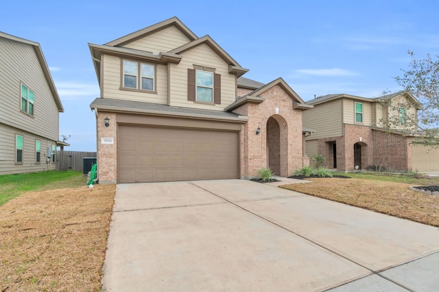 view of front of house with a garage, cooling unit, and a front lawn