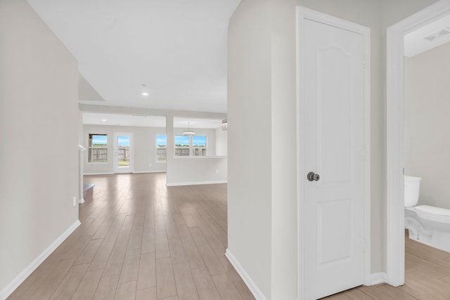 hallway featuring light hardwood / wood-style flooring