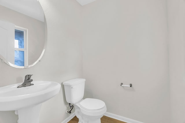 bathroom with sink and toilet