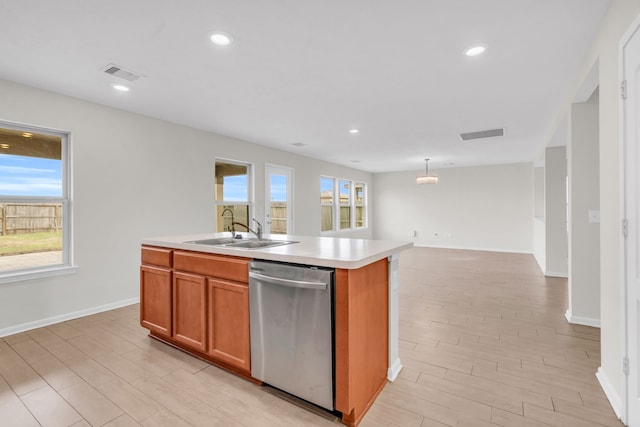 kitchen with sink, light hardwood / wood-style flooring, dishwasher, a kitchen island with sink, and decorative light fixtures