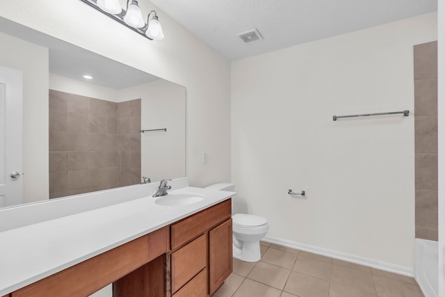 full bathroom featuring tile patterned flooring, vanity, plus walk in shower, and toilet