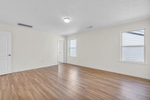 unfurnished room featuring light wood-type flooring