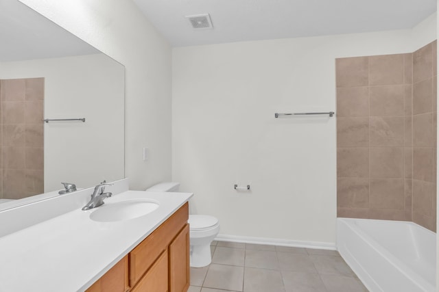 bathroom featuring tile patterned flooring, vanity, and toilet