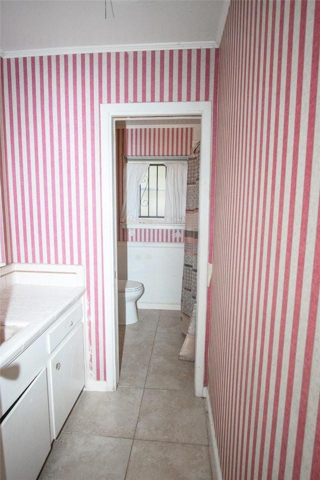 bathroom with tile patterned floors, toilet, and vanity