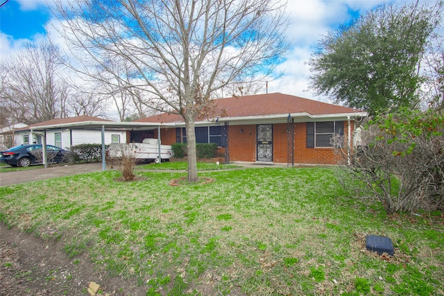 ranch-style home with a front yard and a carport