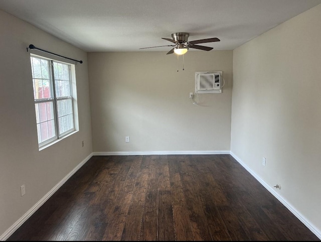 empty room featuring ceiling fan, dark wood-type flooring, and a wall unit AC