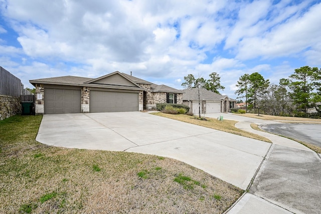 single story home featuring a garage and a front yard