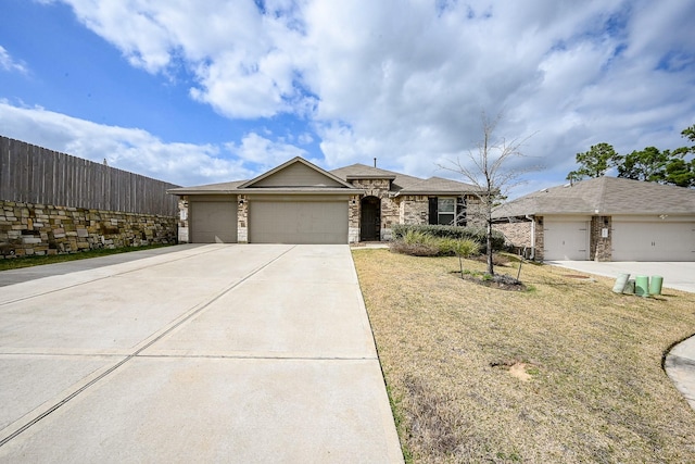 ranch-style home featuring a garage and a front lawn