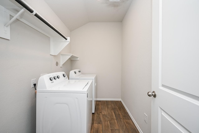 laundry room with dark wood-type flooring and washer and clothes dryer