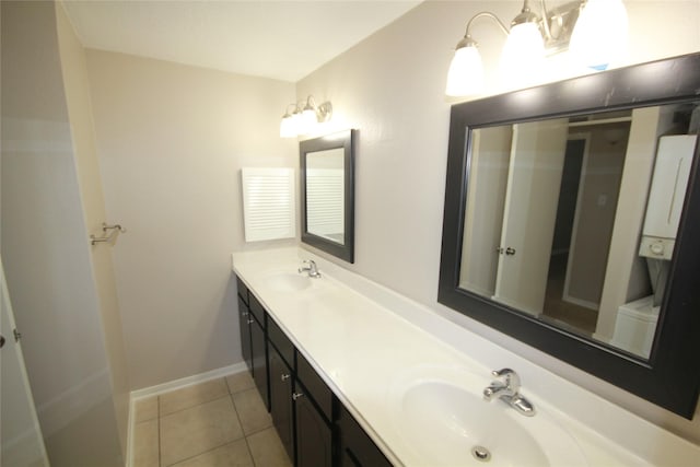 bathroom with tile patterned flooring and vanity