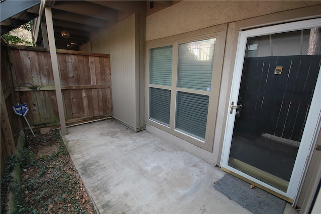 doorway to property with a patio area