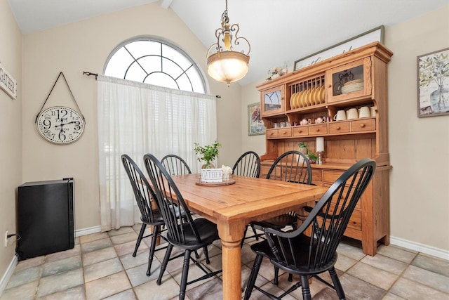 dining space with vaulted ceiling