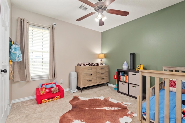 bedroom with light carpet and ceiling fan