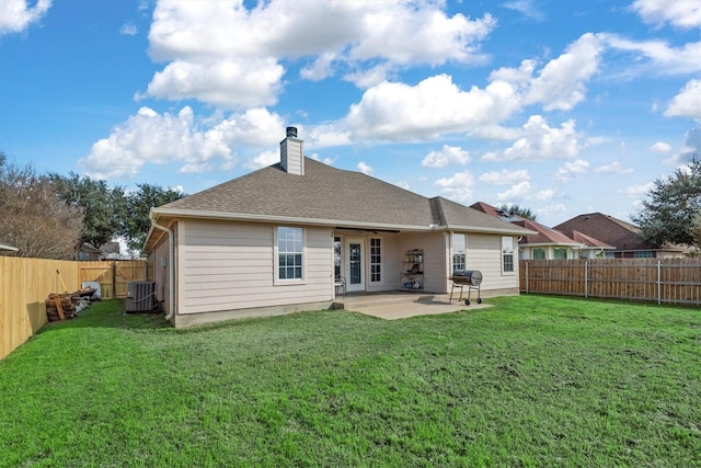 back of property featuring a patio, a yard, and cooling unit