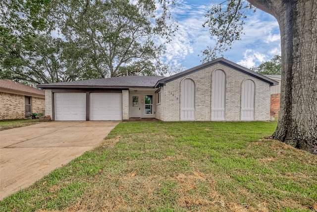 ranch-style house with a garage and a front yard