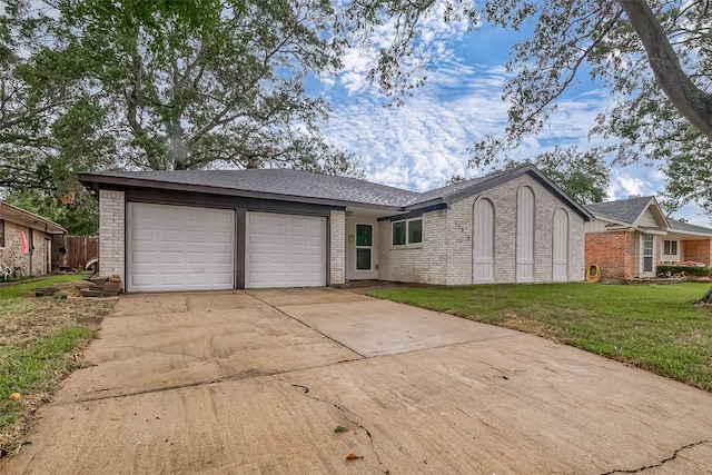 single story home with a garage and a front yard