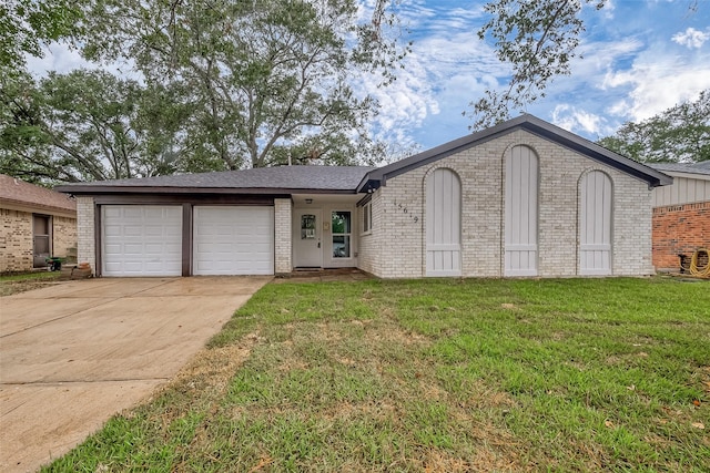 ranch-style house featuring a garage and a front yard