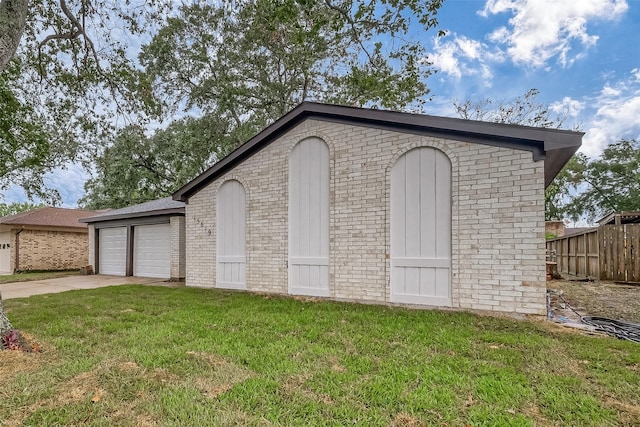 view of outdoor structure with a lawn