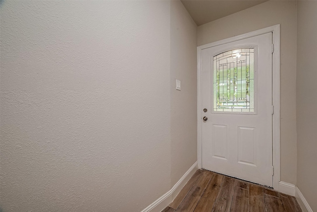 doorway with dark wood-type flooring