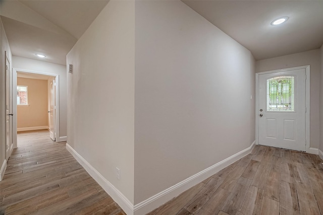 corridor featuring light hardwood / wood-style floors