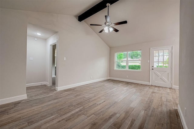 unfurnished living room with ceiling fan, light hardwood / wood-style flooring, and vaulted ceiling with beams