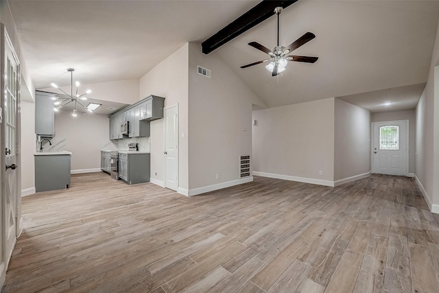 unfurnished living room featuring sink, high vaulted ceiling, light wood-type flooring, beamed ceiling, and ceiling fan with notable chandelier