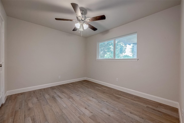 spare room featuring ceiling fan and light hardwood / wood-style floors