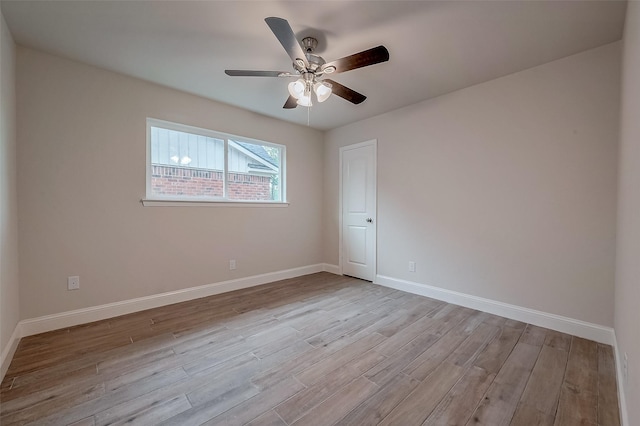 spare room featuring ceiling fan and light wood-type flooring