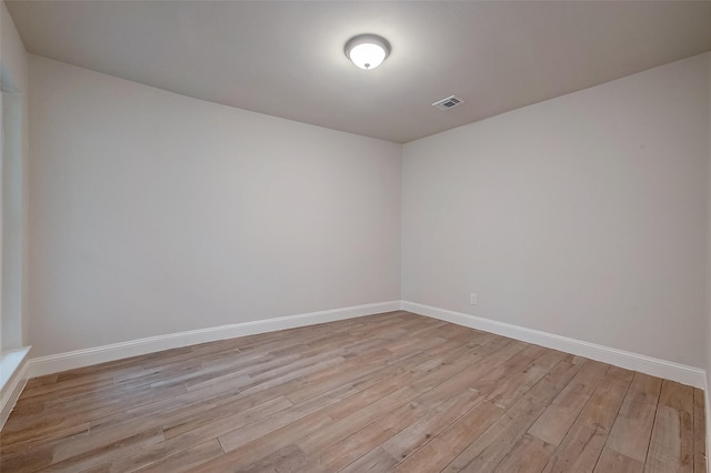 spare room featuring light hardwood / wood-style flooring