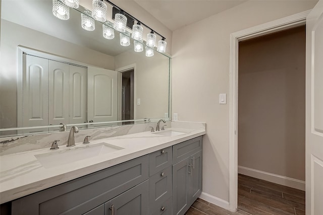 bathroom with vanity and wood-type flooring