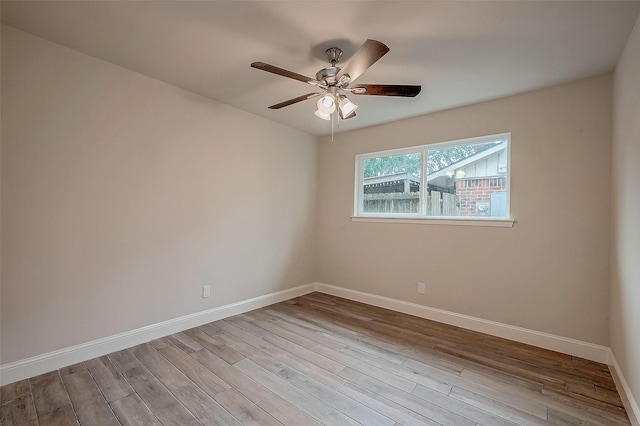 empty room featuring ceiling fan and light wood-type flooring