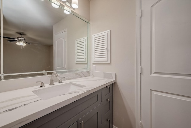 bathroom featuring ceiling fan and vanity