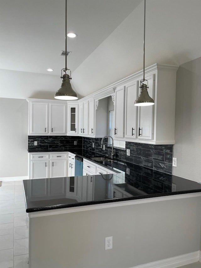 kitchen with white cabinetry, pendant lighting, kitchen peninsula, and dishwasher