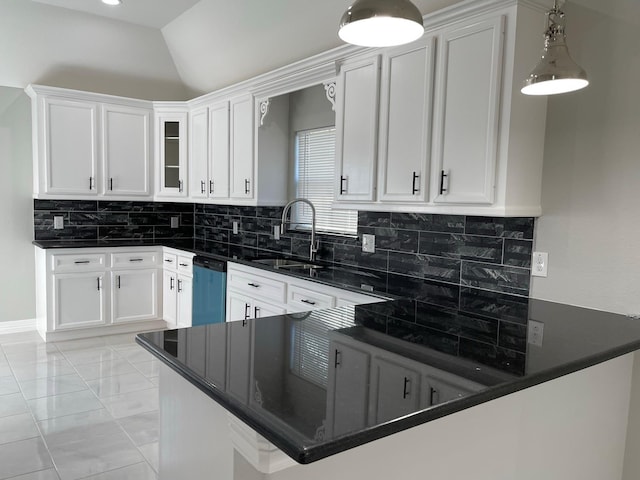 kitchen featuring dishwasher, sink, white cabinets, and kitchen peninsula