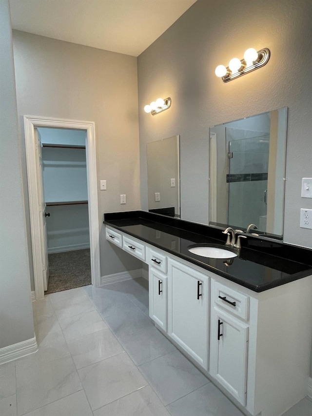 bathroom featuring vanity and an enclosed shower