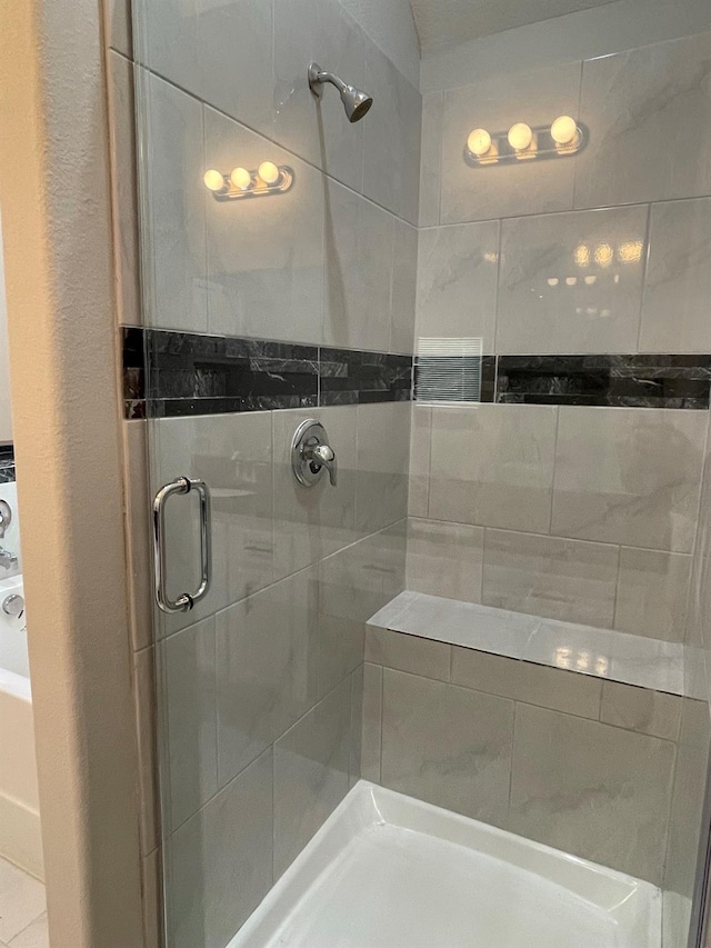 bathroom with a shower with shower door