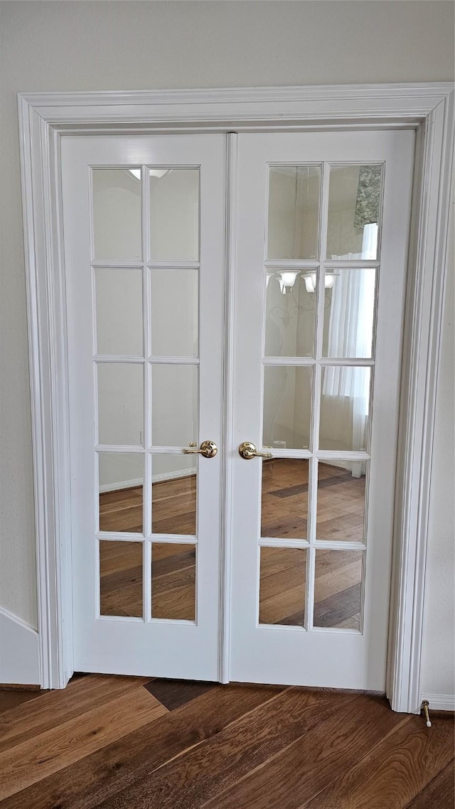 doorway featuring dark wood-style floors and french doors