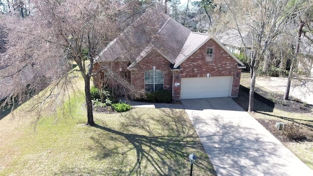 view of front of home with roof with shingles, concrete driveway, and brick siding