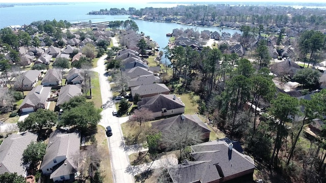 birds eye view of property featuring a water view and a residential view