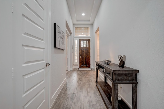 doorway with hardwood / wood-style flooring