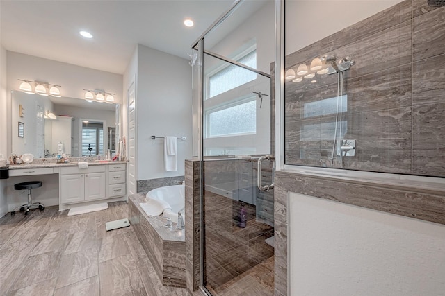 bathroom featuring vanity and plus walk in shower