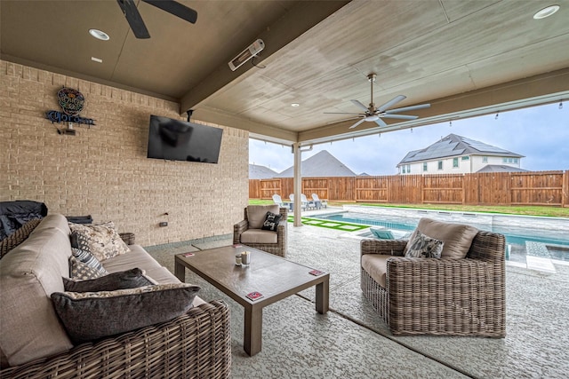 view of patio / terrace with a fenced in pool, an outdoor hangout area, and ceiling fan