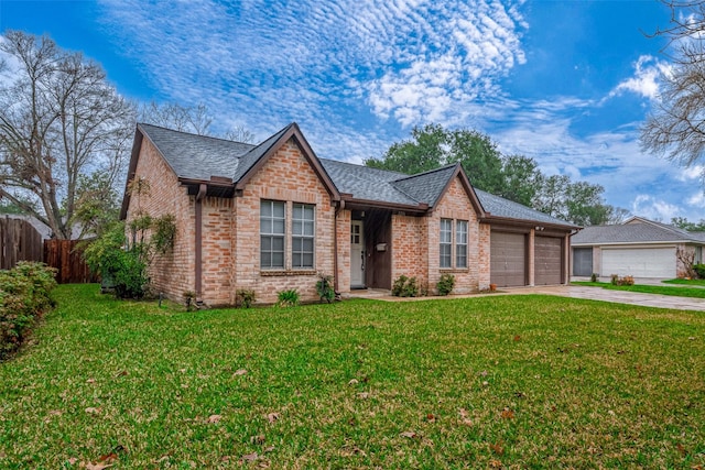 view of front of house featuring a garage and a front lawn